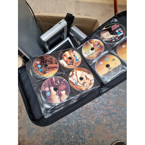 872 - A box containing DVD wallet with contents, Hyundai DVD player, Venturer portable DVD player with dua... 