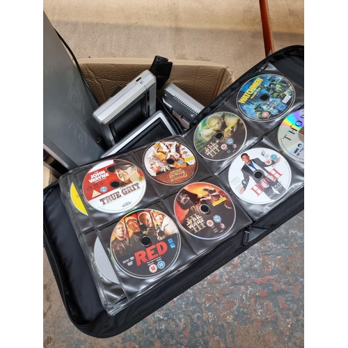 872 - A box containing DVD wallet with contents, Hyundai DVD player, Venturer portable DVD player with dua... 