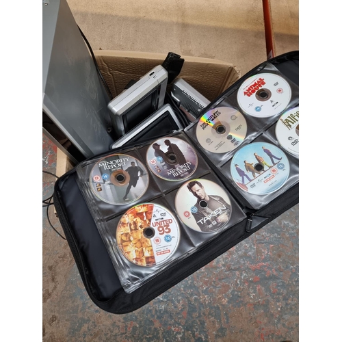 872 - A box containing DVD wallet with contents, Hyundai DVD player, Venturer portable DVD player with dua... 