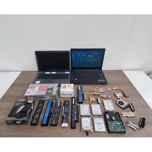 883 - A collection of items to include Lenovo IdeaPad laptop, HP laptop, boxed Nokia 2760 flip mobile phon... 