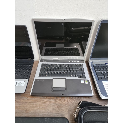 886 - Four laptops, one cased Packard Bell Windows 8, one Acer Windows Vista, one HP Windows XP Home Editi... 