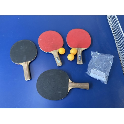 201 - A Kettler Topstar folding table tennis table with four paddles - approx. 76cm high x 275cm long x 15... 