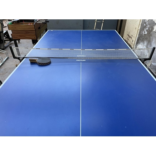 201 - A Kettler Topstar folding table tennis table with four paddles - approx. 76cm high x 275cm long x 15... 