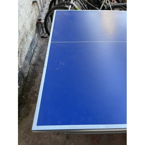 201 - A Kettler Topstar folding table tennis table with four paddles - approx. 76cm high x 275cm long x 15... 