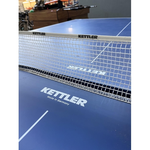 201 - A Kettler Topstar folding table tennis table with four paddles - approx. 76cm high x 275cm long x 15... 