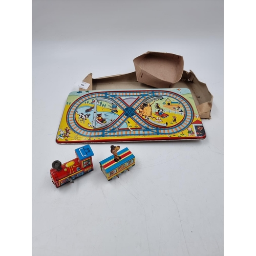 486 - A vintage T.P.S tin plate wind up train set