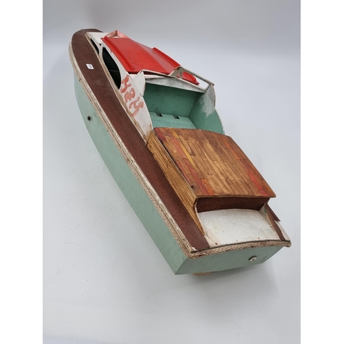 496 - A scratch built wooden motorized boat