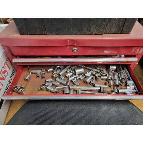 235 - Two tools boxes, one metal stackable containing various tools to include sockets, hammers, pliers et... 