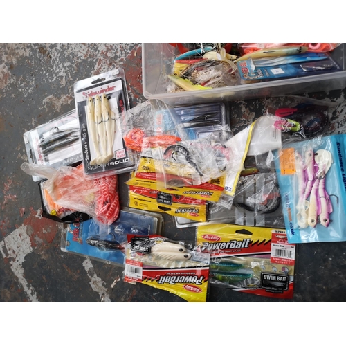 195 - A collection of fishing tackle to include Daiwa Sand Storm 12' beach casting rod, NGT Bech Pro tri p... 