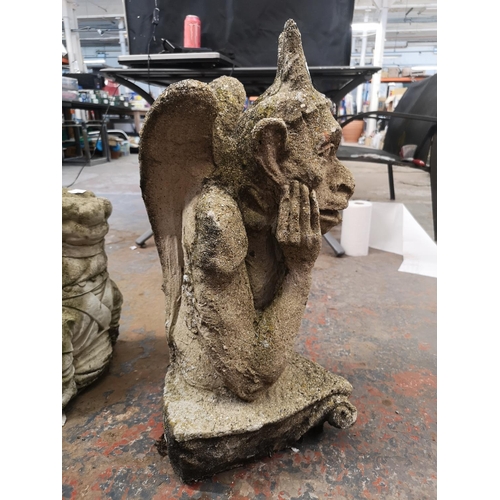 244 - A cast stone gargoyle - approx. 66cm high