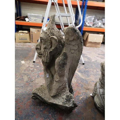 244 - A cast stone gargoyle - approx. 66cm high