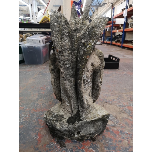 244 - A cast stone gargoyle - approx. 66cm high