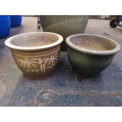 247A - Six glazed terracotta planters - largest approx. 40cm high x 48cm diameter