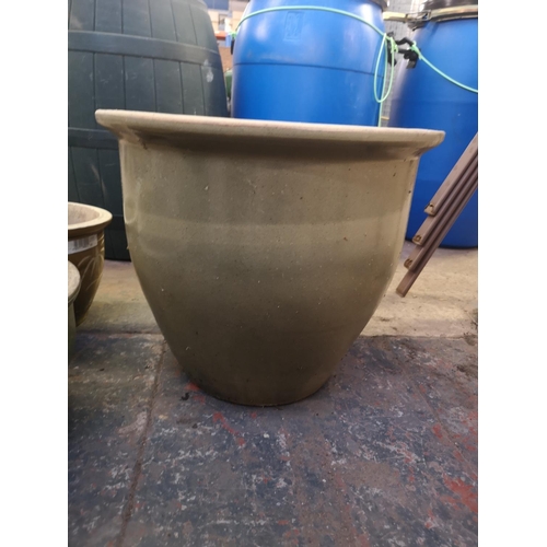 247A - Six glazed terracotta planters - largest approx. 40cm high x 48cm diameter