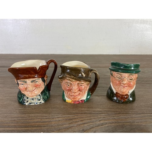 417 - Twelve items, six West German Goebel Hummel figurines and six Royal Doulton miniature character jugs