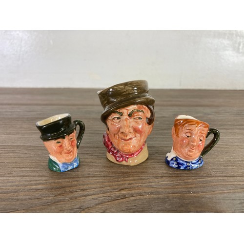 417 - Twelve items, six West German Goebel Hummel figurines and six Royal Doulton miniature character jugs