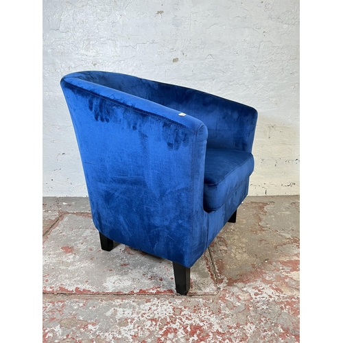 101 - A modern blue velvet upholstered tub chair