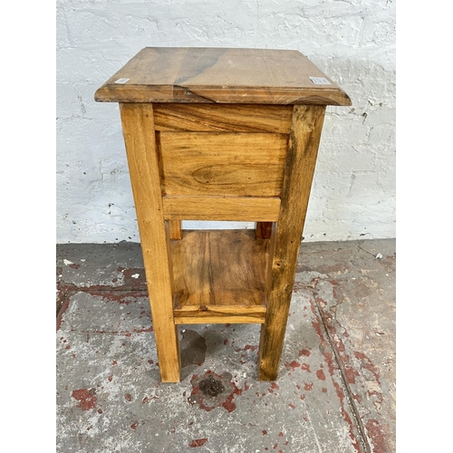 126A - An Indian Sheesham wood single drawer two tier lamp table - approx. 65.5cm high x 30.5cm wide x 30.5... 