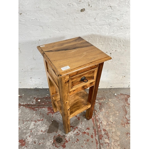 126A - An Indian Sheesham wood single drawer two tier lamp table - approx. 65.5cm high x 30.5cm wide x 30.5... 