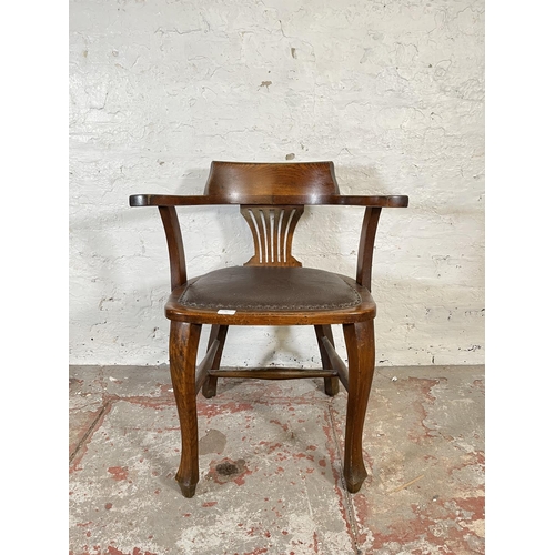 45 - A 1930s oak and brown leatherette desk chair