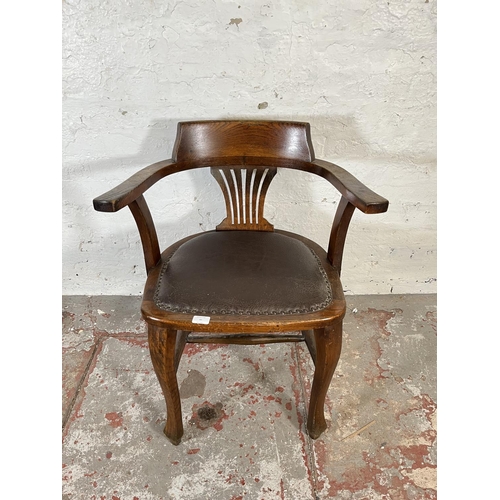 45 - A 1930s oak and brown leatherette desk chair