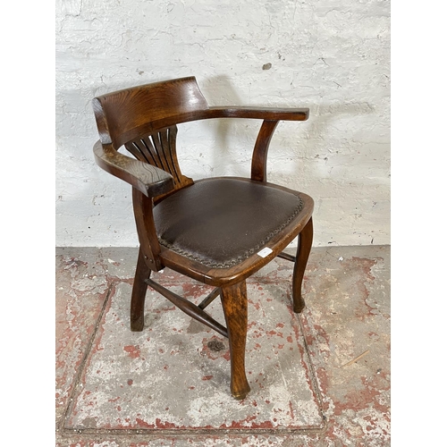 45 - A 1930s oak and brown leatherette desk chair