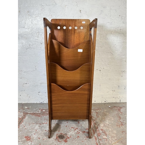 82 - An Arts & Crafts Finnigans Ltd. mahogany three tier magazine rack - approx. 97cm high x 36cm wide x ... 