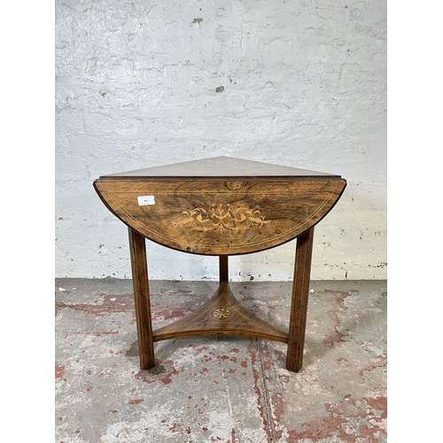 84 - A 19th century inlaid rosewood trifold two tier occasional table - approx. 57cm high x 70cm diameter