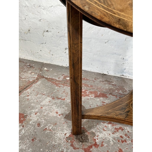 84 - A 19th century inlaid rosewood trifold two tier occasional table - approx. 57cm high x 70cm diameter