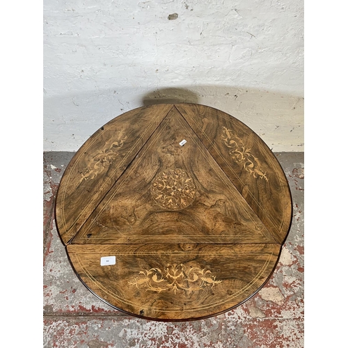 84 - A 19th century inlaid rosewood trifold two tier occasional table - approx. 57cm high x 70cm diameter