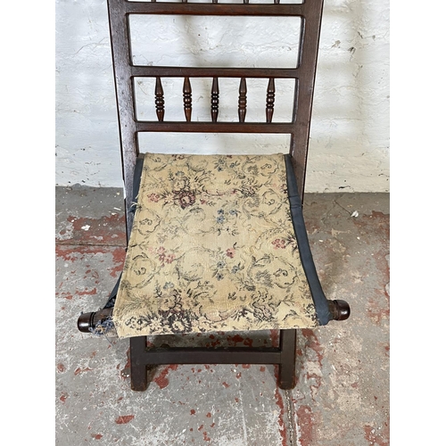 85 - A Boer War oak and tapestry folding chair made by P.E. Kruger K. G. St Helena 1901, believed to be p... 