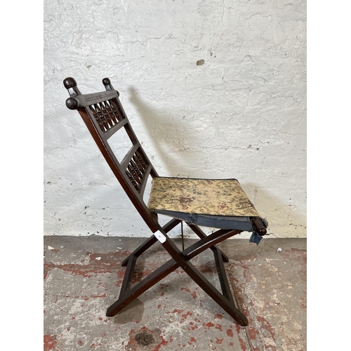 85 - A Boer War oak and tapestry folding chair made by P.E. Kruger K. G. St Helena 1901, believed to be p... 