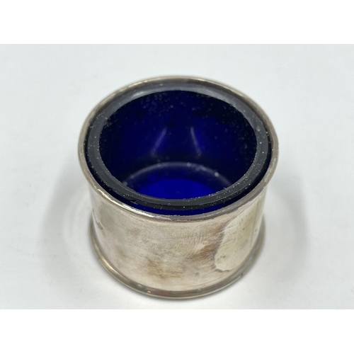 1252 - Two pieces of Atkin Brothers hallmarked Sheffield silver, one condiment pot with blue glass liner an... 