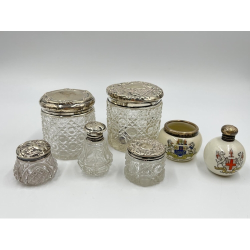 1257 - Seven ceramic and glass bottles and pots with hallmarked sterling silver tops - approx. gross silver... 