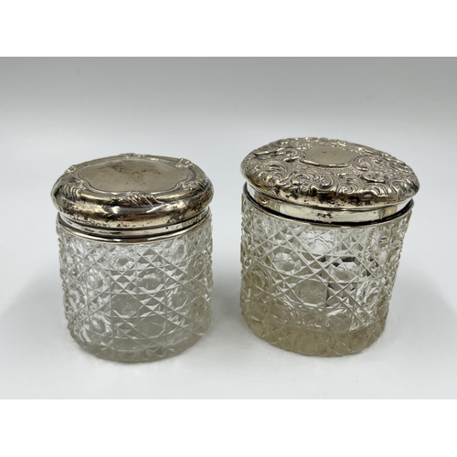 1257 - Seven ceramic and glass bottles and pots with hallmarked sterling silver tops - approx. gross silver... 