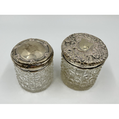 1257 - Seven ceramic and glass bottles and pots with hallmarked sterling silver tops - approx. gross silver... 