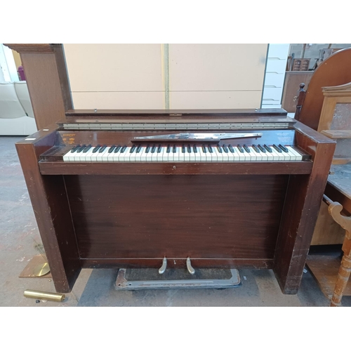 833A - A mid 20th century Eavestaff Pianette seventy-three key two pedal minipiano