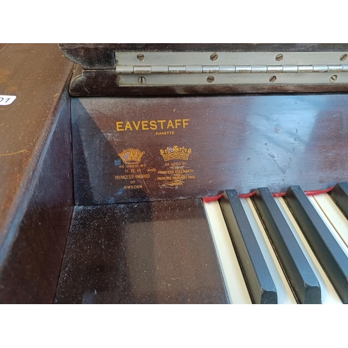 833A - A mid 20th century Eavestaff Pianette seventy-three key two pedal minipiano