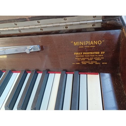 833A - A mid 20th century Eavestaff Pianette seventy-three key two pedal minipiano