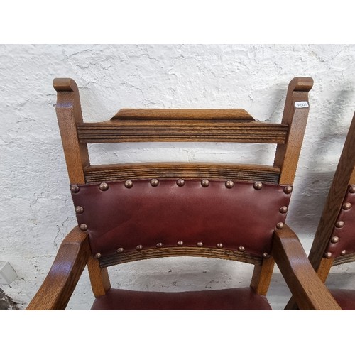 120 - Four Old Charm Cromwellian style oak and burgundy leatherette dining chairs