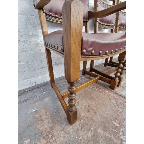 120 - Four Old Charm Cromwellian style oak and burgundy leatherette dining chairs