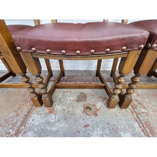 120 - Four Old Charm Cromwellian style oak and burgundy leatherette dining chairs