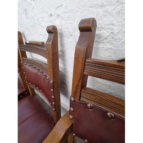 120 - Four Old Charm Cromwellian style oak and burgundy leatherette dining chairs