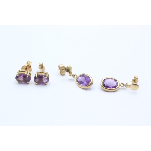 1006 - Two pairs of 9ct gold amethyst earrings - approx. gross weight 1.9 grams