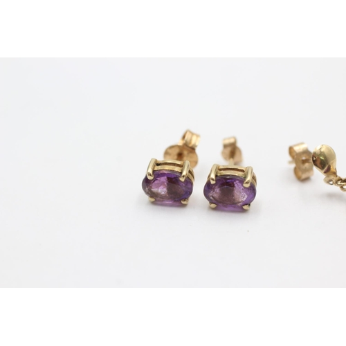 1006 - Two pairs of 9ct gold amethyst earrings - approx. gross weight 1.9 grams