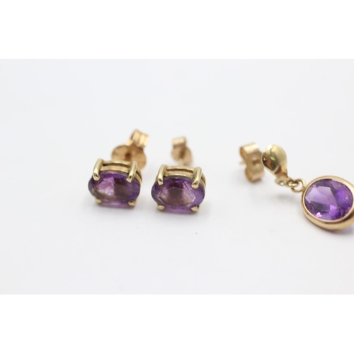 1006 - Two pairs of 9ct gold amethyst earrings - approx. gross weight 1.9 grams