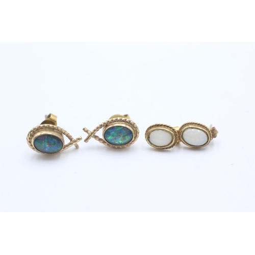 1007 - Two pairs of 9ct gold opal stud earrings - approx. gross weight 3.6 grams