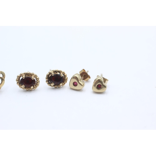 1009 - Three pairs of 9ct gold gemstone earrings, one opal, one ruby and one garnet - approx. gross weight ... 