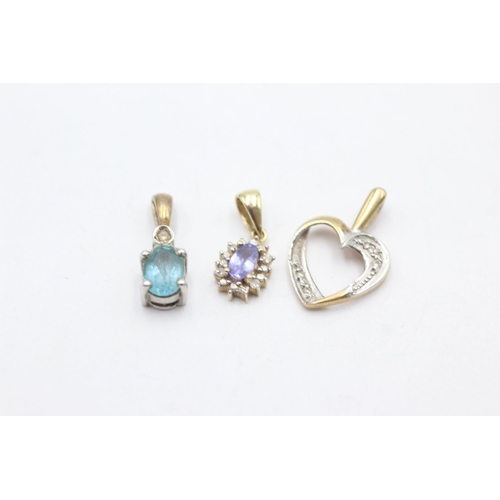 1012 - Three 9ct gold diamond pendants, one topaz, one tanzanite and one heart shaped - approx. gross weigh... 