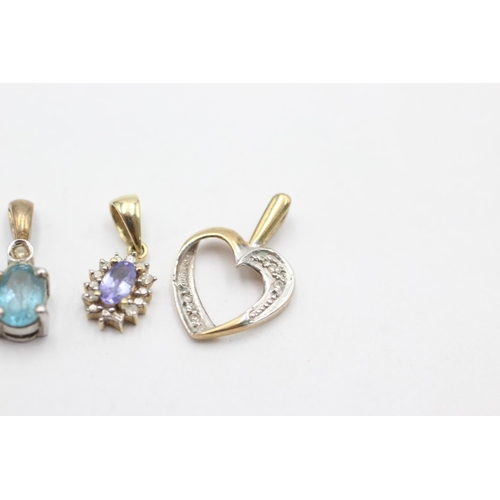 1012 - Three 9ct gold diamond pendants, one topaz, one tanzanite and one heart shaped - approx. gross weigh... 